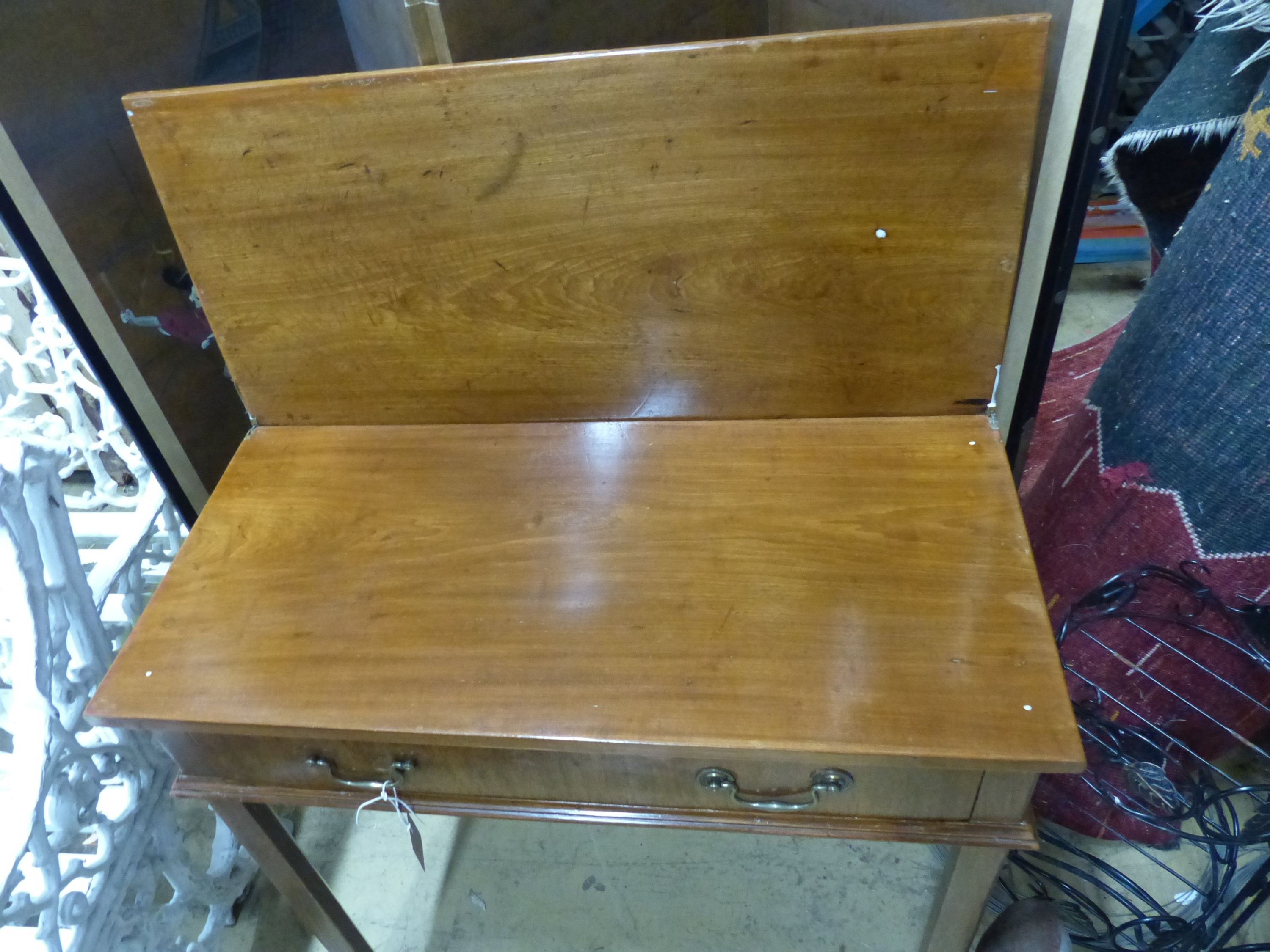 A George III rectangular mahogany folding tea table, W.74cm D.35cm H.73cm